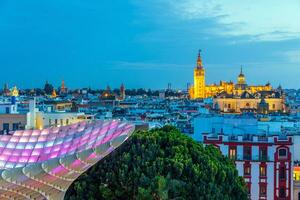 Metropol Parasol wooden structure with Seville city skyline in the old quarter of Seville in Spain photo