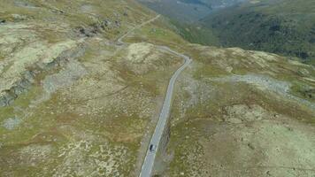 Mountain Road in Norway at Sunny Summer Day. Aerial Reveal Shot. Drone is Flying Forward, Camera is Tilting Up video