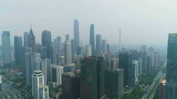 Guangzhou City Skyline. Guangdong, China. Aerial View. Drone Flies Backwards and Upwards. Reveal Shot video