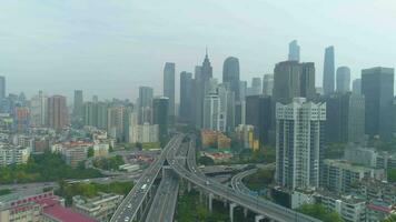 Guangzhou City and Complex Road Overpass. Guangdong, China. Cloudy Day. Aerial View. Drone Flies Forward video