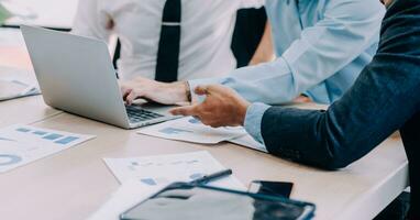 Entrepreneurs and business people conference in modern meeting room, happy multiracial coworkers have fun cooperating working together at office meeting, asian teamwork concept photo