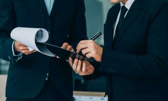 Entrepreneurs and business people conference in modern meeting room, happy multiracial coworkers have fun cooperating working together at office meeting, asian teamwork concept photo