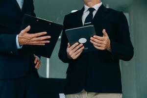 Entrepreneurs and business people conference in modern meeting room, happy multiracial coworkers have fun cooperating working together at office meeting, asian teamwork concept photo