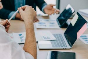 Entrepreneurs and business people conference in modern meeting room, happy multiracial coworkers have fun cooperating working together at office meeting, asian teamwork concept photo