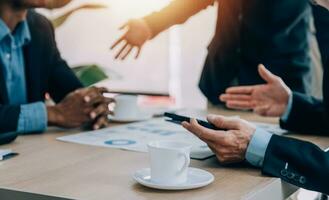 Entrepreneurs and business people conference in modern meeting room, happy multiracial coworkers have fun cooperating working together at office meeting, asian teamwork concept photo