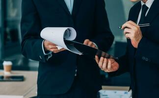 Entrepreneurs and business people conference in modern meeting room, happy multiracial coworkers have fun cooperating working together at office meeting, asian teamwork concept photo