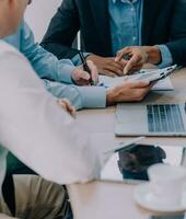 Entrepreneurs and business people conference in modern meeting room, happy multiracial coworkers have fun cooperating working together at office meeting, asian teamwork concept photo