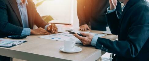 Entrepreneurs and business people conference in modern meeting room, happy multiracial coworkers have fun cooperating working together at office meeting, asian teamwork concept photo