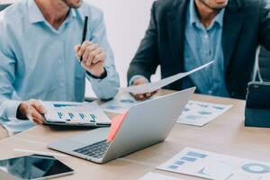 Entrepreneurs and business people conference in modern meeting room, happy multiracial coworkers have fun cooperating working together at office meeting, asian teamwork concept photo