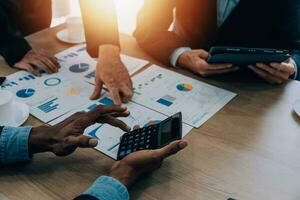 Entrepreneurs and business people conference in modern meeting room, happy multiracial coworkers have fun cooperating working together at office meeting, asian teamwork concept photo