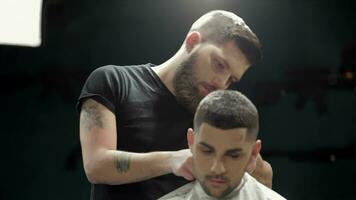 Men's hairstyling and haircutting in a barber shop video