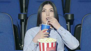 Asian woman alone in the movie theater video