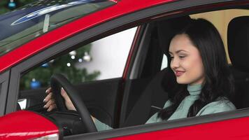 Buyer woman doing thumps-up in car video