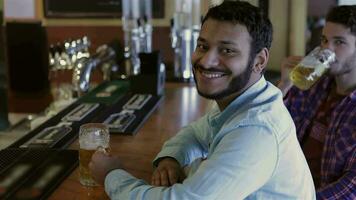 Top view of two men while drinking beer video