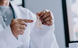 Female doctor holding virtual Lungs in hand. Handrawn human organ, copy space on right side, raw photo colors. Healthcare hospital service concept stock photo