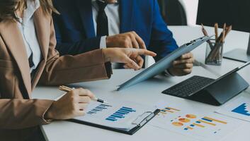 Team of business people working together in the meeting room office, teamwork background charts and graphs banner, double exposure successful teamwork,business planning concept. photo