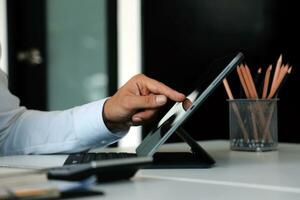 Close up of Business team analyzing income charts and graphs with modern laptop computer. Business analysis and strategy concept. photo