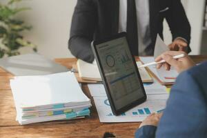 Team of business people working together in the meeting room office, teamwork background charts and graphs banner, double exposure successful teamwork,business planning concept. photo