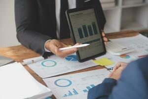 Team of business people working together in the meeting room office, teamwork background charts and graphs banner, double exposure successful teamwork,business planning concept. photo