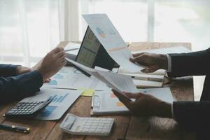 Team of business people working together in the meeting room office, teamwork background charts and graphs banner, double exposure successful teamwork,business planning concept. photo