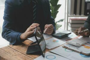 Team of business people working together in the meeting room office, teamwork background charts and graphs banner, double exposure successful teamwork,business planning concept. photo