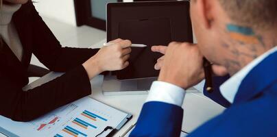 Close up of Business team analyzing income charts and graphs with modern laptop computer. Business analysis and strategy concept. photo