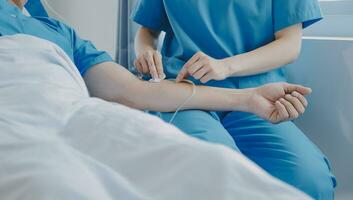 Women Asian doctors hold the patient hand and encourage and provide medical advice While checking the patient health in bed. Concept of Care and compassion, antenatal care, Threatened abortion photo