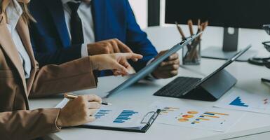 Team of business people working together in the meeting room office, teamwork background charts and graphs banner, double exposure successful teamwork,business planning concept. photo