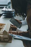 Construction and structure concept of Engineer or architect meeting for project working with partner and engineering tools on model building and blueprint in working site, contract for both companies. photo