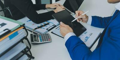 Close up of Business team analyzing income charts and graphs with modern laptop computer. Business analysis and strategy concept. photo