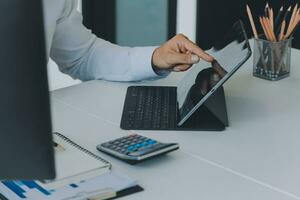 Close up of Business team analyzing income charts and graphs with modern laptop computer. Business analysis and strategy concept. photo