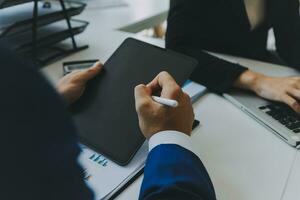 Close up of Business team analyzing income charts and graphs with modern laptop computer. Business analysis and strategy concept. photo