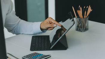 Close up of Business team analyzing income charts and graphs with modern laptop computer. Business analysis and strategy concept. photo