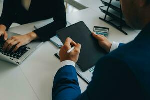 Close up of Business team analyzing income charts and graphs with modern laptop computer. Business analysis and strategy concept. photo