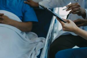 Women Asian doctors hold the patient hand and encourage and provide medical advice While checking the patient health in bed. Concept of Care and compassion, antenatal care, Threatened abortion photo