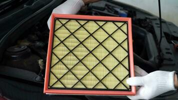 Replacing a new air filter in a passenger car,Automotive part concept. video