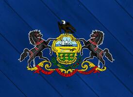 Flag and coat of arms of Commonwealth of Pennsylvania on a textured background. Concept collage. photo