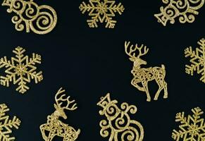 Trendy Christmas background pattern composition made with various golden Christmas decoration objects.  Minimal Xmas or New Year concept. Fancy winter holidays idea. Christmas aesthetic. Copy space. photo