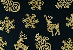 Trendy Christmas background pattern composition made with various golden Christmas decoration objects.  Minimal Xmas or New Year concept. Fancy winter holidays idea. Christmas aesthetic. Flat lay. photo