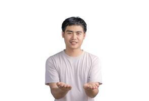 Young handsome man wearing a casual t-shirt standing over white background approving doing positive gestures with his hand, presenting and showing with hands, smilling and happy for success. photo