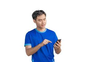 Happy man cheering excitedly in celebration after good news. Excited guy winner holding cellphone winning game online or investing trading, using mobile app celebrates victory success photo