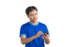 Happy man cheering excitedly in celebration after good news. Excited guy winner holding cellphone winning game online or investing trading, using mobile app celebrates victory success photo