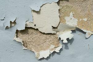 Close-up view of the wall paint peeling off. photo