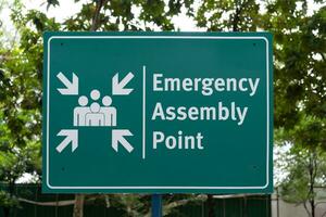 Emergency assembly point sign in the park. photo