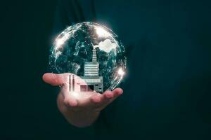 Businessman showing online virtual hologram factories With internet technology, the concept of global data connection with technology internet, big data, information search, industry photo