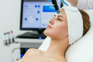 Face Skin Care. Close-up Of Woman Getting Facial Hydro Microdermabrasion Peeling Treatment At Cosmetic Beauty Spa Clinic. Hydra Vacuum Cleaner. Exfoliation, Rejuvenation And Hydratation. Cosmetology. photo