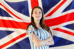 Young woman with flags of English speaking countries photo