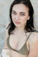 Beautiful bohemian styled and tanned girl at the beach photo