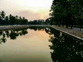 Pond near the temple in Thailand photo