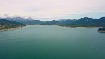 A serene lake nestled among majestic mountains video